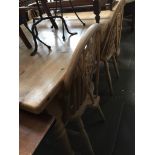 WAXED PINE TABLE AND FOUR BEECH WHEEL BACK CHAIRS. 168CM X 92CM