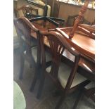 A REPRODUCTION DINING TABLE AND 6 CHAIRS