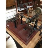 BRASS WOOL WINDER ON MAHOGANY BASE. W72CM