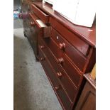 A STAINED PINE CHEST OF DRAWERS