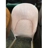 A PINK WOVEN TUB CHAIR