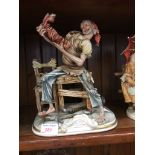 CAPO DI MONTE FIGURE OF A BOOTMAKER. H28CM