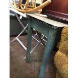 AN OLD METAL TOP TABLE