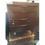 A TEAK CHEST OF DRAWERS