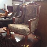 A REPRODUCTION WINGBACK CHAIR. W69CM D70CM H106CM