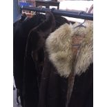 A SHEEPSKIN COAT AND 2 FAUX FUR COATS