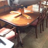 A REPRODUCTION MAHOGANY EXTENDING TABLE AND 6 CHAIRS.