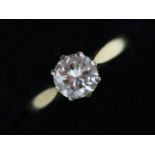 A single stone diamond solitaire ring, the eight claw and crown set brilliant cut diamond weighing