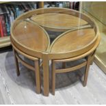 A Nathan round glass top teak nest of tables, diam. 82cm & height 51cm.