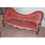 A Victorian mahogany shaped back settee with carved scroll arms and legs, length 205cm, depth 80cm &