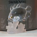 A Swarovski Crystal ornament formed as a fish swimming past coral, boxed with certificate. Condition