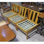 A set of three Ercol light beech easy chairs.