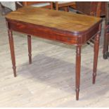 A Regency mahogany fold over tea table with fluted sides and legs, width 91.5cm, min. depth 45cm &