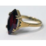 A yellow metal garnet ring, marked '9ct', gross wt. 1.9g, size J.