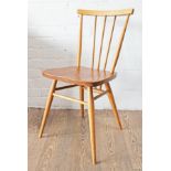 An Ercol light elm and beech spindle back chair.