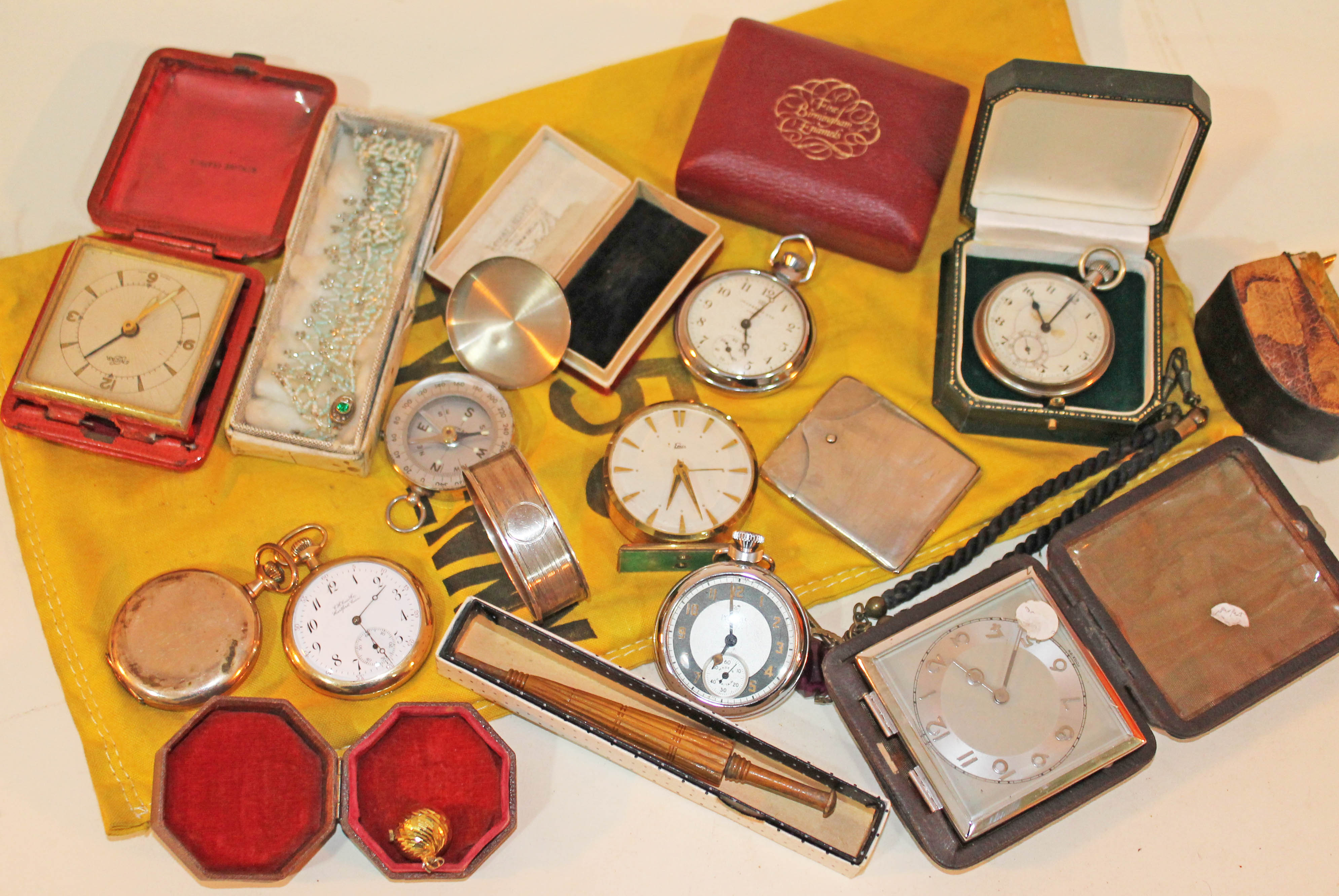 A mixed lot to include five pocket watches, a compass, a hallmarked silver napkin ring, a card