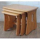 An Ercol Windsor light elm and beech nest of tables.