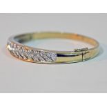 A hallmarked 9ct gold diamond bangle, diam. approx. 5.5cm, gross wt. 16.1g.