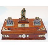 A Victorian oak standish with, having silver plated mounts, glass inwells, single drawer and