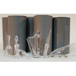 A group of six Swarovski Crystal ornaments comprising four instruments, a bell and a seahorse, boxed