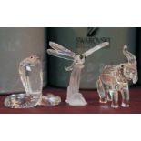 Three boxed Swarovski Crystal ornaments comprising a cobra, a dragonfly and an elephant, each