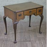 A good quality George II style mahogany lowboy, crossbanded in oak, cabriole legs with carved