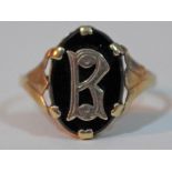 A Victorian monogrammed and black stone signet ring marked '9', gross wt. 2.8g, size X.