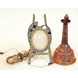 A mixed lot of metal ware comprising a ship's hanging light, a copper lighthouse and a decorated