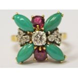 A multi gemstone gold ring set with diamonds, green turquoise and garnet coloured stones, total