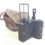 A vintage ensign camera with case.