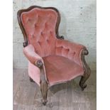 A Victorian mahogany spoon back armchair with scroll arms, width 79cm, depth 90cm & height 107cm.