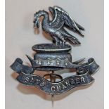A hallmarked silver British Infantry Kings Liverpool Regiment cap badge.
