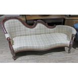 A Victorian walnut settee with carved shaped back, scroll arms and feet, length 195cm, depth