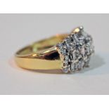 A hallmarked 18ct gold diamond cluster ring, gross wt. 5.7g, size K.