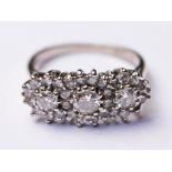 A hallmarked 18ct white gold diamond cluster ring, gross wt. 4.7g, size N.