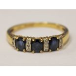 A 9ct gold diamond and sapphire ring, gross wt. 2.4g, size S.