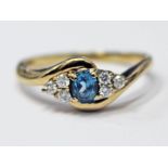 A 9ct gold diamond and topaz ring, gross wt. 2.7g, size T.