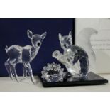 A group of three Swarovski Crystal ornaments comprising a hedgehog, a squirrel and a fawn, boxed