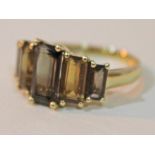 A hallmarked 9ct gold smokey quartz ring, gross wt. 2.8g, size O.