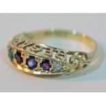 A hallmarked 9ct gold multi gemstone regard ring, gross wt. 2.3g, size L.