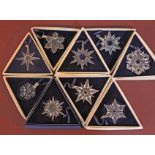 A group of nine Swarovski Crystal Christmas decorations, years 1995 - 2002, with boxes.