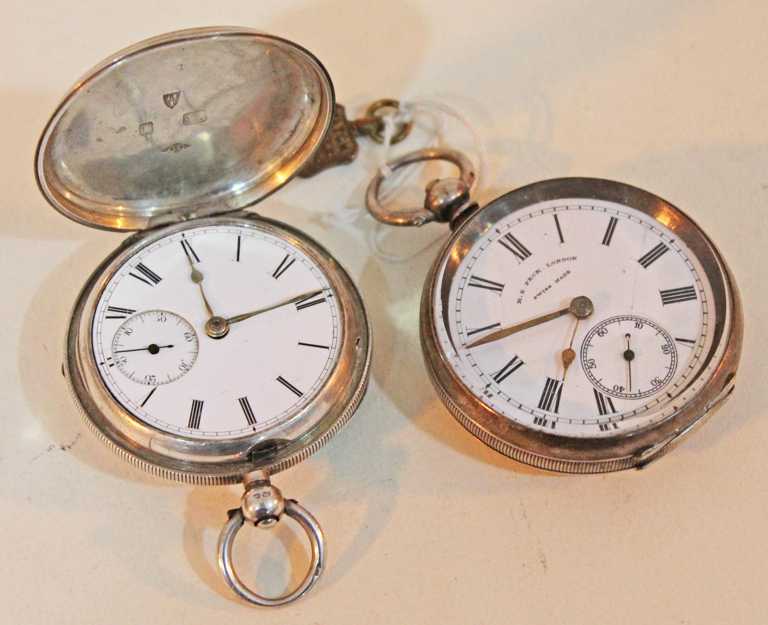 Two silver pocket watches.