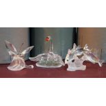 Three boxed Swarovski Crystal ornaments comprising a butterfly, a swan and fish, each boxed with