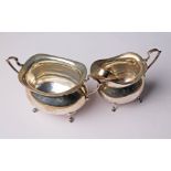 A hallmarked slver sugar bowl and cream jug together with hallmarked silver sugar tongs, wt. 7 1/