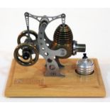 A Bohm Stirling engine on beech base, length 16cm.