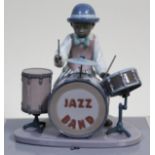 A Lladro figure Jazz Drums with box. Condition - break and repair to drummer's right drum stick