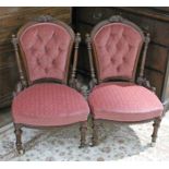 A pair of Victorian carved walnut nursing chairs, width 53cm, depth 65cm & height 82cm.