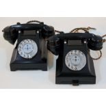 Two black bakelite telephones.