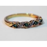 A hallmarked 9ct gold diamond and emerald ring, gross wt. 2.2g, size T.