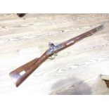 A replica Brown Bess flintock musket, length 107cm.